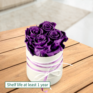 4 purple roses in a hat box