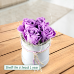 4 lilac roses in a hat box