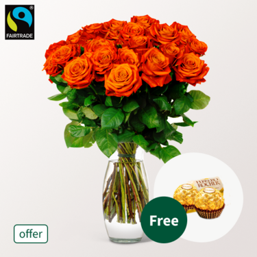 Orange Fairtrade roses in a bunch with 2 Ferrero Rocher